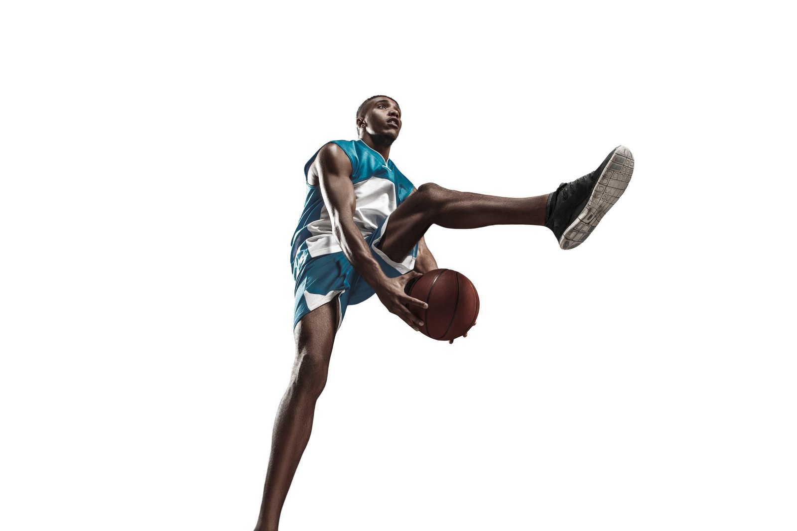 Full length portrait of a basketball player with ball